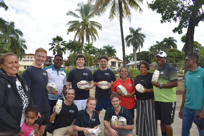 KFK volunteers and local coaches holding new netballs
